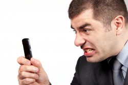 stressed businessman screaming in telephone Jerry Kidd